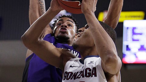 Gonzaga guard Zach Norvell Jr. (23) shoots while defended by North Alabama forward Emanuel Littles during the second half of an NCAA college basketball game in Spokane, Wash., Friday, Dec. 28, 2018. Gonzaga won 96-51. (AP Photo/Young Kwak)