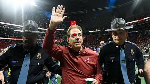FILE - In this Dec. 1, 2018, file photo, Alabama head coach Nick Saban leaves the field after the Southeastern Conference championship NCAA college football game against Georgia in Atlanta. UCF’s Josh Heupel, Notre Dame’s Brian Kelly and Saban are the finalists for The Associated Press national college football coach of the year after leading their teams to unbeaten regular seasons. The winner will be announced Monday, Dec. 17. (AP Photo/John Amis, File)