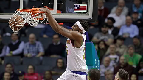 New York Knicks’ Mitchell Robinson (26) dunks against the Charlotte Hornets during the first half of an NBA basketball game in Charlotte, N.C., Monday, Jan. 28, 2019. (AP Photo/Chuck Burton)