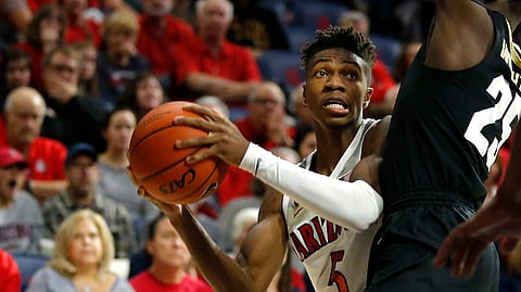 Arizona guard Brandon Randolph (5) drives on Colorado guard McKinley Wright IV during the second half pf an NCAA college basketball game Thursday, Jan. 3, 2019, in Tucson, Ariz. Arizona won 64-56. (AP Photo/Rick Scuteri)