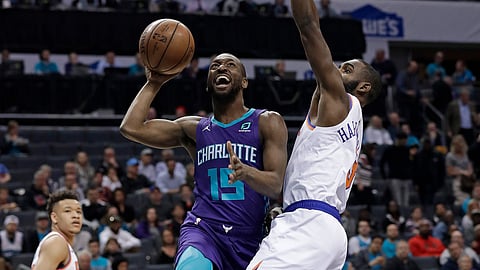 Charlotte Hornets’ Kemba Walker (15) drives against New York Knicks’ Tim Hardaway Jr. (3) during the first half of an NBA basketball game in Charlotte, N.C., Monday, Jan. 28, 2019. (AP Photo/Chuck Burton)