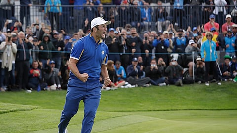 FILE - In this Sept. 30, 2018, file photo, Europe’s Jon Rahm celebrates after beating Tiger Woods in a singles match on the final day of the 42nd Ryder Cup at Le Golf National in Saint-Quentin-en-Yvelines, outside Paris, France. Rahm says it was the best moment of his golf career.(AP Photo/Matt Dunham, File)
