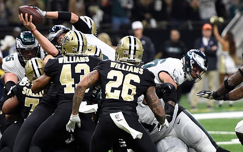 Philadelphia Eagles quarterback Nick Foles (9) leaps into the end zone for touchdown in the first half of an NFL divisional playoff football game against the Philadelphia Eagles in New Orleans, Sunday, Jan. 13, 2019. (AP Photo/Bill Feig)