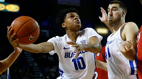 FILE - In this Saturday, Jan. 12, 2019, file photo, Buffalo guard Ronaldo Segu (10) looks to shoot against Miami of Ohio as center Brock Bertram (41) helps clear the lane during the first half of an NCAA college basketball game, in Buffalo N.Y. Buffalo is off to its best start in school history. (AP Photo/Jeffrey T. Barnes, File)