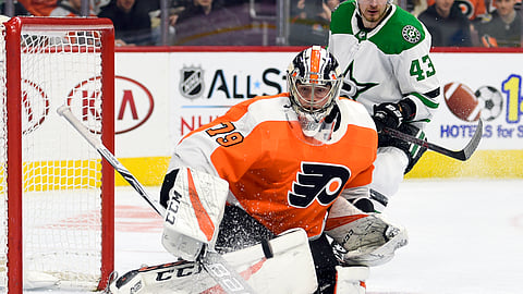 Philadelphia Flyers goaltender Carter Hart watches the puck after making a save in front of Dallas Stars’ Valeri Nichushkin, rear, during the first period of an NHL hockey game Thursday, Jan. 10, 2019, in Philadelphia. (AP Photo/Derik Hamilton)