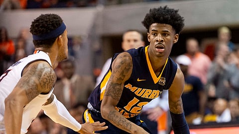 Murray State guard Ja Morant (12) works around Auburn guard Bryce Brown (2) during the first half of an NCAA college basketball game, Saturday, Dec. 22, 2018, in Auburn, Ala. (AP Photo/Vasha Hunt)