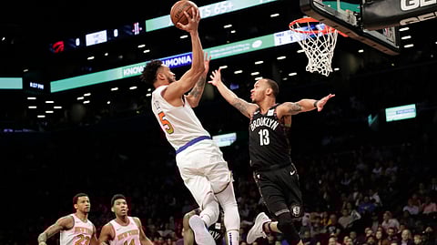 Brooklyn Nets’ Shabazz Napier (13) defends against New York Knicks’ Courtney Lee (5) during the first half of an NBA basketball game Friday, Jan. 25, 2019, in New York. (AP Photo/Frank Franklin II)