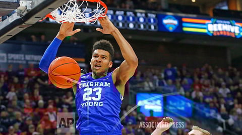 BYU forward Yoeli Childs (23) dunks on Utah guard Parker Van Dyke (5) in the first half during an NCAA college basketball game Saturday Dec. 8, 2018, in Salt Lake City. (AP Photo/Rick Bowmer)