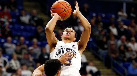 Penn State’s Rasir Bolton (13) takes a shot over Wisconsin’s D’Mitrik Trice (0) during second half action of an NCAA college basketball game in State College, Pa. Sunday, Jan. 6, 2019. Wisconsin won 71-52. (AP Photo/Chris Knight)