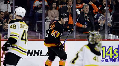 Philadelphia Flyers’ Sean Couturier, center, celebrates after scoring a goal past Boston Bruins’ Jaroslav Halak, right, and Matt Grzelcyk during the second period of an NHL hockey game, Wednesday, Jan. 16, 2019, in Philadelphia. (AP Photo/Matt Slocum)