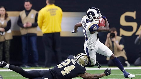 Los Angeles Rams’ JoJo Natson tries to get past New Orleans Saints’ Vonn Bell during the first half the NFL football NFC championship game Sunday, Jan. 20, 2019, in New Orleans. (AP Photo/John Bazemore)