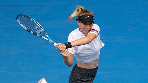 United States’ Amanda Anisimova makes a backhand return to Aryna Sabalenka of Belarus during their third round match at the Australian Open tennis championships in Melbourne, Australia, Friday, Jan. 18, 2019. (AP Photo/Mark Schiefelbein)