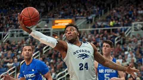 Nevada forward Jordan Caroline (24) grabs a rebound against Air Force in the first half of an NCAA college basketball game in Reno, Nev., Saturday, Jan. 19, 2019. (AP Photo/Tom R. Smedes)