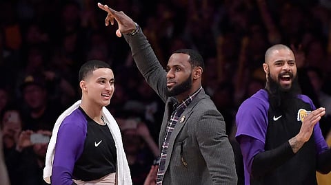 Los Angeles Lakers forward LeBron James, center, celebrates along with forward Kyle Kuzma, left, and center Tyson Chandler after the Lakers scored during the second half of an NBA basketball game against the Detroit Pistons on Wednesday, Jan. 9, 2019, in Los Angeles. The Lakers won 113-100. (AP Photo/Mark J. Terrill)