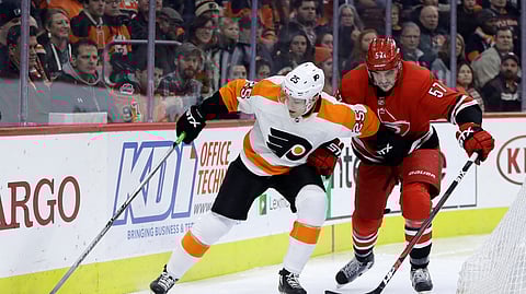 Philadelphia Flyers’ James van Riemsdyk, left, tries to keep Carolina Hurricanes’ Trevor van Riemsdyk away from the puck during the second period of an NHL hockey game Thursday, Jan. 3, 2019, in Philadelphia. (AP Photo/Matt Slocum)
