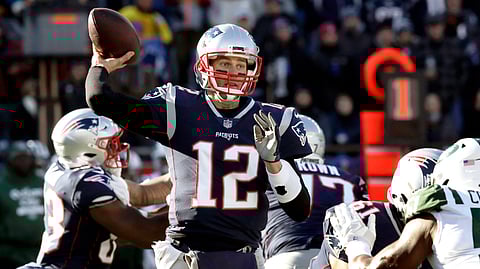 New England Patriots quarterback Tom Brady passes under pressure from the New York Jets during the first half of an NFL football game, Sunday, Dec. 30, 2018, in Foxborough, Mass. (AP Photo/Charles Krupa)