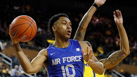 Air Force Falcons guard A.J. Walker (10) passes the ball as Michigan Wolverines guard Charles Matthews (1) defends during the first half of an NCAA college basketball game, Saturday, Dec. 22, 2018, in Ann Arbor, Mich. (AP Photo/Carlos Osorio)
