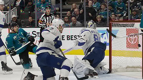 San Jose Sharks center Joe Pavelski, left, scores a goal past Tampa Bay Lightning goaltender Andrei Vasilevskiy, from Russia, right, during the first period of an NHL hockey game in San Jose, Calif., Saturday, Jan. 5, 2019. (AP Photo/Jeff Chiu)