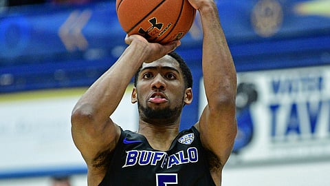 Buffalo CJ Massinburg shoots a three point basket during the second half of an NCAA college basketball game against Kent State, Friday, Jan. 25, 2019, in Kent, Ohio. (AP Photo/David Dermer)