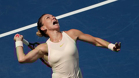 FILE - In this Aug. 27, 2018, file photo, Simona Halep, of Romania, serves to Kaia Kanepi, of Estonia, during the first round of the U.S. Open tennis tournament, in New York. No. 1-ranked Halep returns to competitive tennis this week at the Sydney International unsure if her back injury has fully healed.(AP Photo/Andres Kudacki, File)