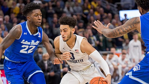 Marquette guard Markus Howard, right, drives to the basket against Seton Hall guard Myles Cale, left, during the first half of an NCAA college basketball game Saturday, Jan. 12, 2019, in Milwaukee. (AP Photo/Darren Hauck)