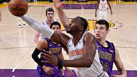 New York Knicks forward Noah Vonleh, front, shoots as Los Angeles Lakers center Ivica Zubac, right, defends during the first half of an NBA basketball game Friday, Jan. 4, 2019, in Los Angeles. (AP Photo/Mark J. Terrill)