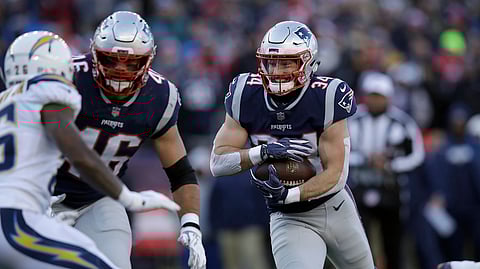 New England Patriots running back Rex Burkhead runs toward the goal line for a touchdown against the Los Angeles Chargers during the first half of an NFL divisional playoff football game, Sunday, Jan. 13, 2019, in Foxborough, Mass. (AP Photo/Charles Krupa)