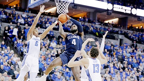 Villanova’s Eric Paschall (4) goes to the basket against Creighton’s Ty-Shon Alexander (5), Christian Bishop (13) and Marcus Zegarowski, rear, during the first half of an NCAA college basketball game in Omaha, Neb., Sunday, Jan. 13, 2019. (AP Photo/Nati Harnik)