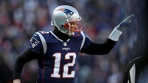 New England Patriots quarterback Tom Brady celebrates one of his team’s five first-half touchdowns against the Los Angeles Chargers during the first half of an NFL divisional playoff football game, Sunday, Jan. 13, 2019, in Foxborough, Mass.