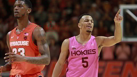 Virginia Tech’s Justin Robinson points to a teammate after an assist in the second half against Syracuse in an NCAA college basketball game in Blacksburg, Va., Saturday, Jan. 26, 2019. (Matt Gentry/The Roanoke Times via AP)