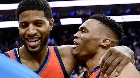 Oklahoma City Thunder’s Paul George, left, celebrates with Russell Westbrook at the end of the team’s NBA basketball game against the Philadelphia 76ers, Saturday, Jan. 19, 2019, in Philadelphia. The Thunder won 117-115. (AP Photo/Michael Perez)