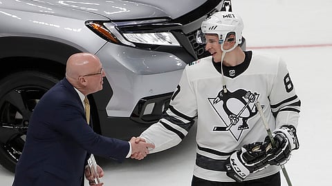 Metropolitan Division’s Sidney Crosby, right, of the Pittsburgh Penguins, is congratulated by NHL Deputy Commissioner Bill Daly after being named the Most Valuable Player of the NHL hockey All-Star Game in San Jose, Calif., Saturday, Jan. 26, 2019. The Metropolitan Division defeated the Central Division 10-5 in the final. (AP Photo/Jeff Chiu)