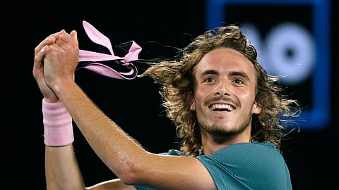 Greece’s Stefanos Tsitsipas celebrates after defeating Switzerland’s Roger Federer in their fourth round match at the Australian Open tennis championships in Melbourne, Australia, Sunday, Jan. 20, 2019. (AP Photo/Mark Schiefelbein)