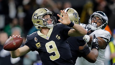 New Orleans Saints quarterback Drew Brees (9) throws an interception on the first play from scrimmage in the first half of an NFL divisional playoff football game against the Philadelphia Eagles, in New Orleans, Sunday, Jan. 13, 2019. (AP Photo/Gerald Herbert)