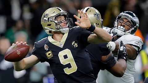 New Orleans Saints quarterback Drew Brees (9) throws an interception on the first play from scrimmage in the first half of an NFL divisional playoff football game against the Philadelphia Eagles, in New Orleans, Sunday, Jan. 13, 2019. (AP Photo/Gerald Herbert)