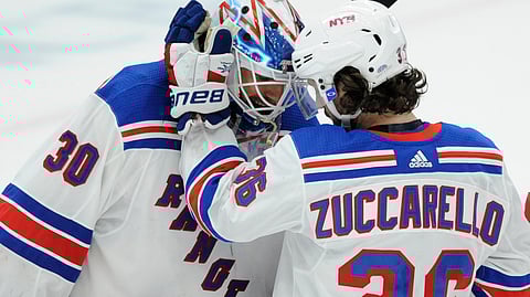 New York Rangers goalie Henrik Lundqvist (30), of Sweden, is congratulated by Mats Zuccarello (36), of Norway, after the team’s 2-1 victory over the St. Louis Blues in an NHL hockey game Monday, Dec. 31, 2018, in St. Louis. (AP Photo/Bill Boyce)