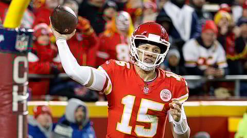 FILE - In this Dec. 30, 2018, file photo, Kansas City Chiefs quarterback Patrick Mahomes (15) throws a touchdown pass to wide receiver Demarcus Robinson, unseen, during the second half of an NFL football game against the Oakland Raiders, in Kansas City, Mo. Mahomes made The Associated Press 2018 NFL All-Pro Team, Friday, Jan. 4, 2018. (AP Photo/Charlie Riedel, File)