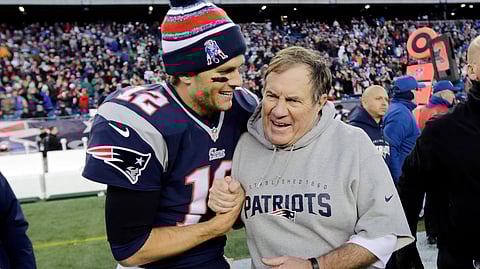 FILE - In this Dec. 14, 2014, file photo, New England Patriots quarterback Tom Brady, left, celebrates with head coach Bill Belichick after defeating the Miami Dolphins 41-13 in an NFL football game in Foxborough, Mass. The Patriots have dominated the AFC for nearly two decades _ if not the entire NFL _ and the coach-quarterback combination of Bill Belichick and Tom Brady will be playing in their eighth conference title game Sunday when New England visits the Chiefs at frigid, hostile Arrowhead Stadium. (AP Photo/Charles Krupa, File)