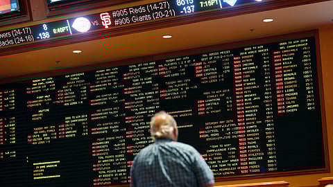 Betting odds are displayed on a board in the sports book at the South Point hotel and casino in Las Vegas. (John Locher)