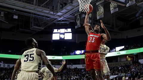 Louisville’s Steven Enoch (23) is fouled as he drives to the basket against Wake Forest’s Isaiah Mucius (1) during the first half of an NCAA college basketball game in Winston-Salem, N.C., Wednesday, Jan. 30, 2019. (AP Photo/Chuck Burton)