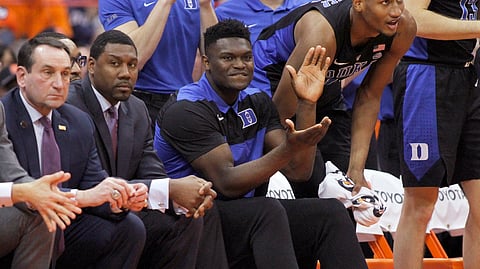 Duke’s Zion Williamson, center, cheers after a basket from the bench. (Nick Lisi)