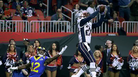 New England Patriots’ Stephon Gilmore, right, intercepts a pass intended for Los Angeles Rams’ Brandin Cooks (12) during the second half of the NFL Super Bowl 53 football game Sunday, Feb. 3, 2019, in Atlanta. (AP Photo/David J. Phillip)