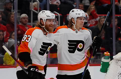 Flyers Jakub Voracek (left) and Oskar Lindblom celebrates a goal Saturday