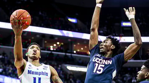Memphis’ Antwann Jones Jr., left, goes up for a shot against UConn’s Sidney Wilson, Sunday, Feb. 10, 2019, in Memphis, Tenn. (Brad Vest/The Commercial Appeal via AP)