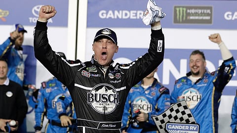Kevin Harvick celebrates in Victory Lane after winning the first of two qualifying races for the NASCAR Daytona 500, Thursday, Feb. 14, 2019. (AP Photo/John Raoux)