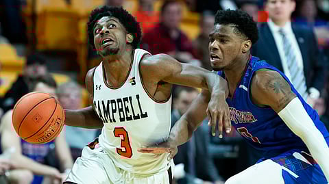 Campbell’s Chris Clemons drives against Presbyterian College’s Chris Martin in a January game (jason E. Miczek)