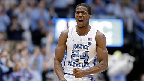 North Carolina’s Kenny Williams (24) reacts following a 3-point basket against Miami in Chapel Hill, N.C., Saturday, Feb. 9, 2019. (AP Photo/Gerry Broome)
