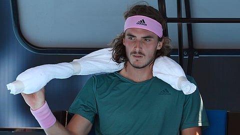 Greece’s Stefanos Tsitsipas rests at the Australian Open tennis championships in Melbourne, Tuesday, Jan. 22, 2019. (AP Photo/Andy Brownbill)