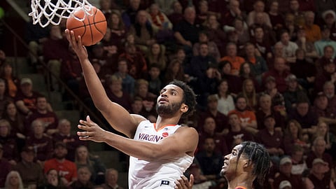 Virginia guard Braxton Key drives past Virginia Tech defender Ahmed Hill in Blacksburg, Va., Monday, Feb. 18, 2019.(AP Photo/Lee Luther Jr.)