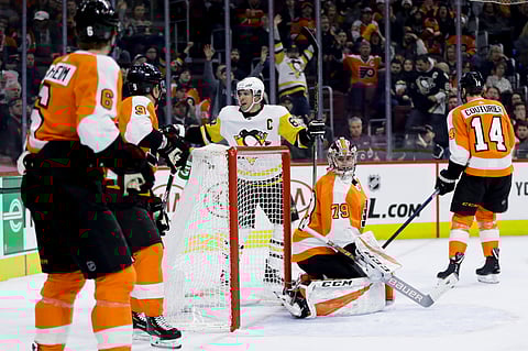 Penguins’ Sidney Crosby (87) celebrates celebrates goal Monday amidst the Flyers